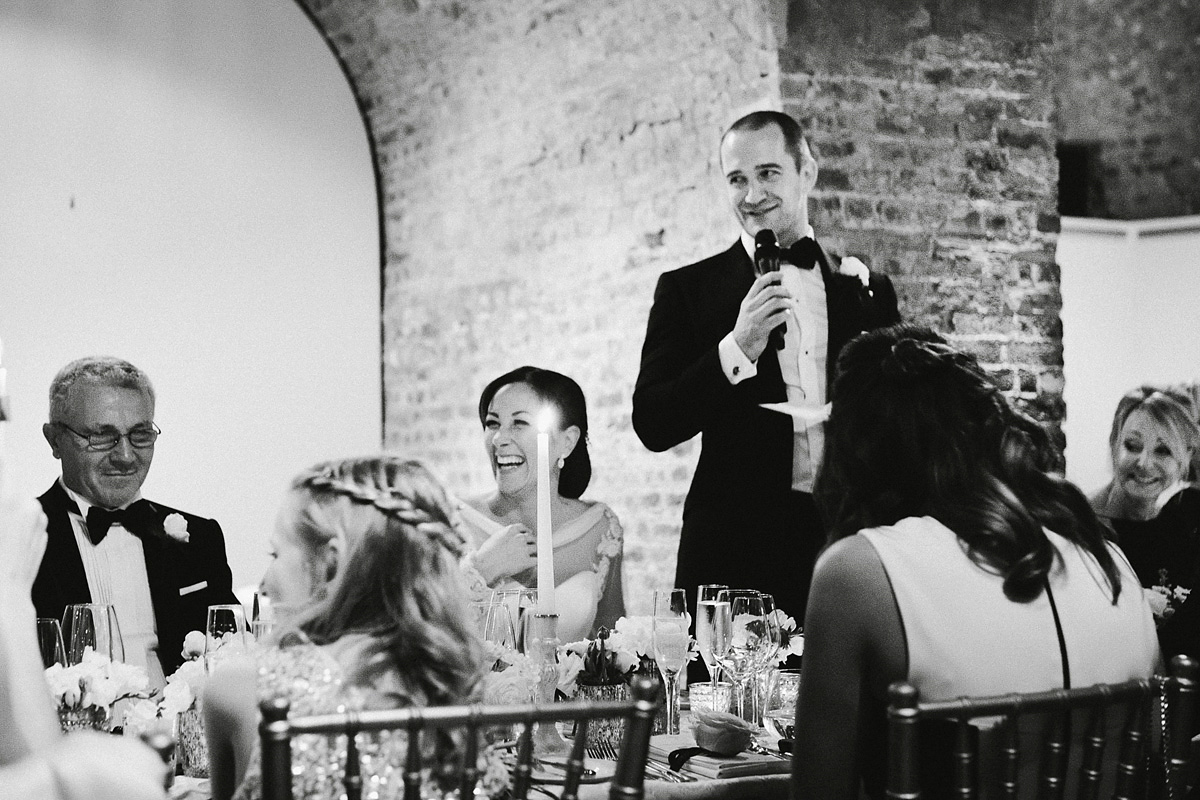 Antonietta wore a chic and elegant long sleeved Suzanne Neville gown for her black tie winter wedding at the RSA in London.