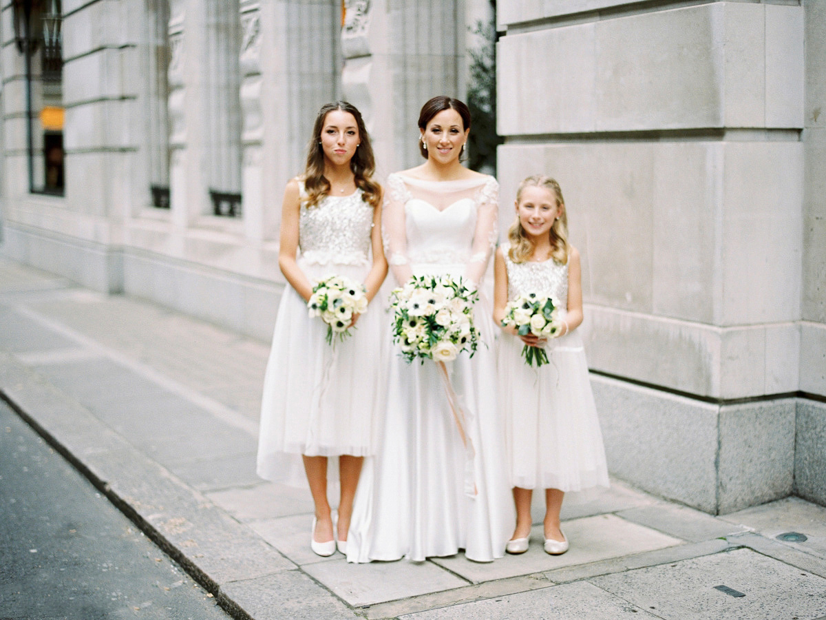 Antonietta wore a chic and elegant long sleeved Suzanne Neville gown for her black tie winter wedding at the RSA in London.