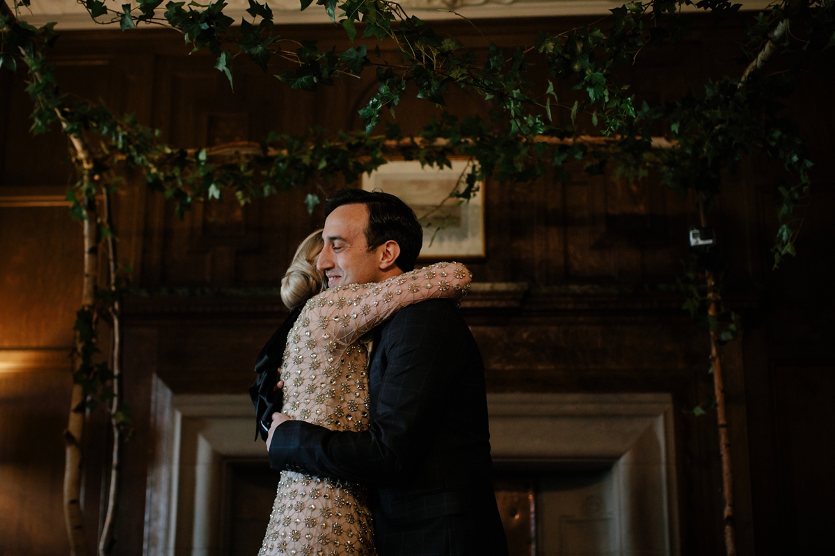 A bride in a gold, embellished Temperley London dress for her wedding at Rowallan Castle in Scotland. Images by Caro Weiss.