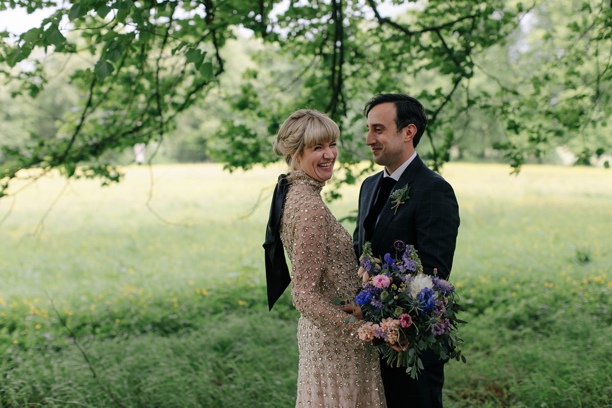 A bride in a gold, embellished Temperley London dress for her wedding at Rowallan Castle in Scotland. Images by Caro Weiss.