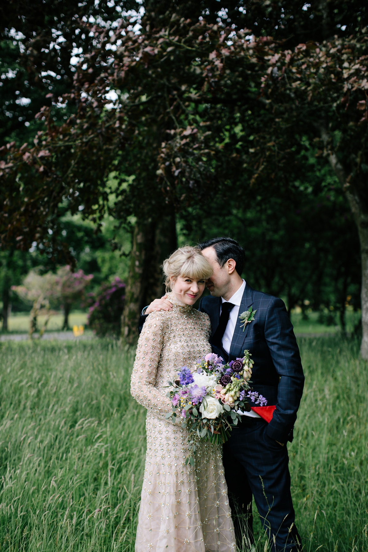 A bride in a gold, embellished Temperley London dress for her wedding at Rowallan Castle in Scotland. Images by Caro Weiss.