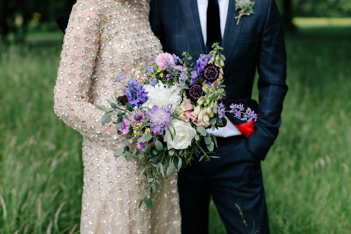 A bride in a gold, embellished Temperley London dress for her wedding at Rowallan Castle in Scotland. Images by Caro Weiss.