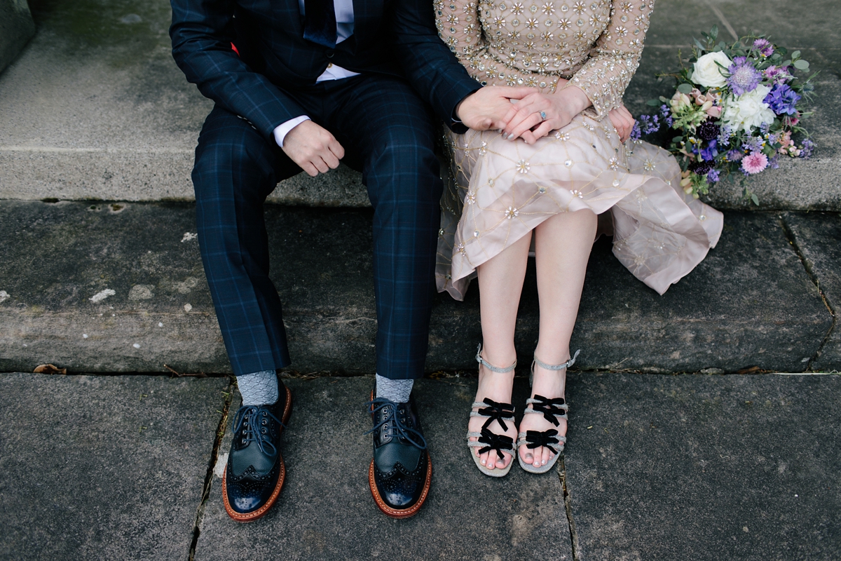 A bride in a gold, embellished Temperley London dress for her wedding at Rowallan Castle in Scotland. Images by Caro Weiss.