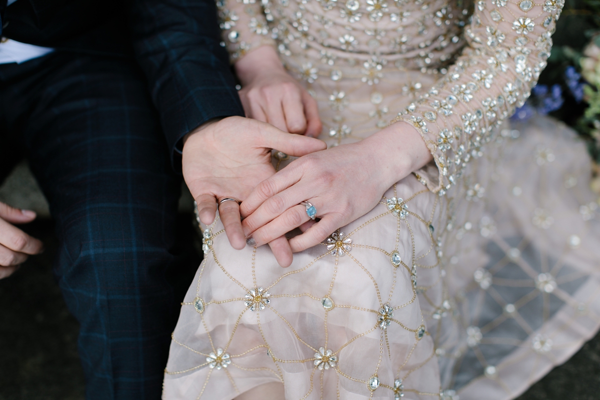 A bride in a gold, embellished Temperley London dress for her wedding at Rowallan Castle in Scotland. Images by Caro Weiss.