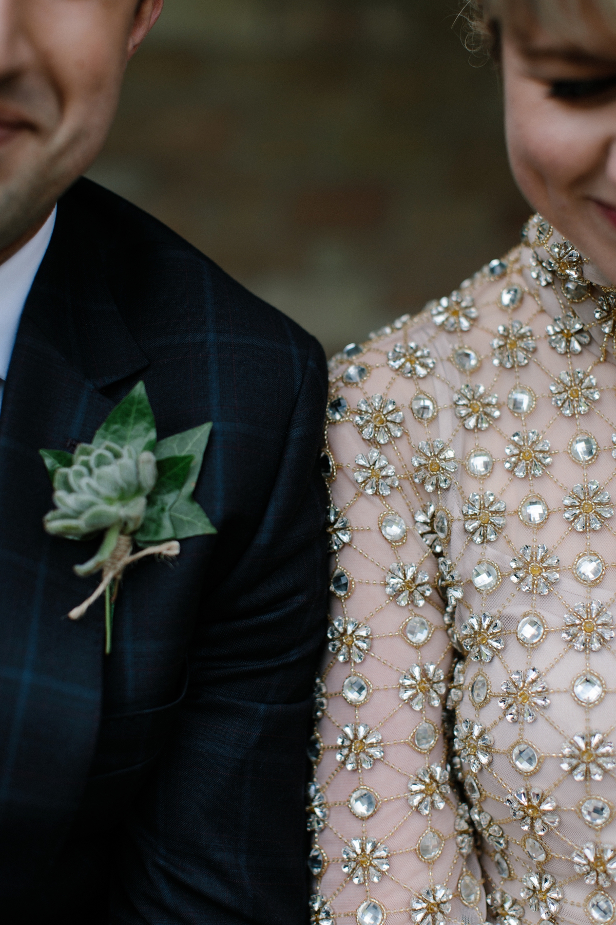 A bride in a gold, embellished Temperley London dress for her wedding at Rowallan Castle in Scotland. Images by Caro Weiss.