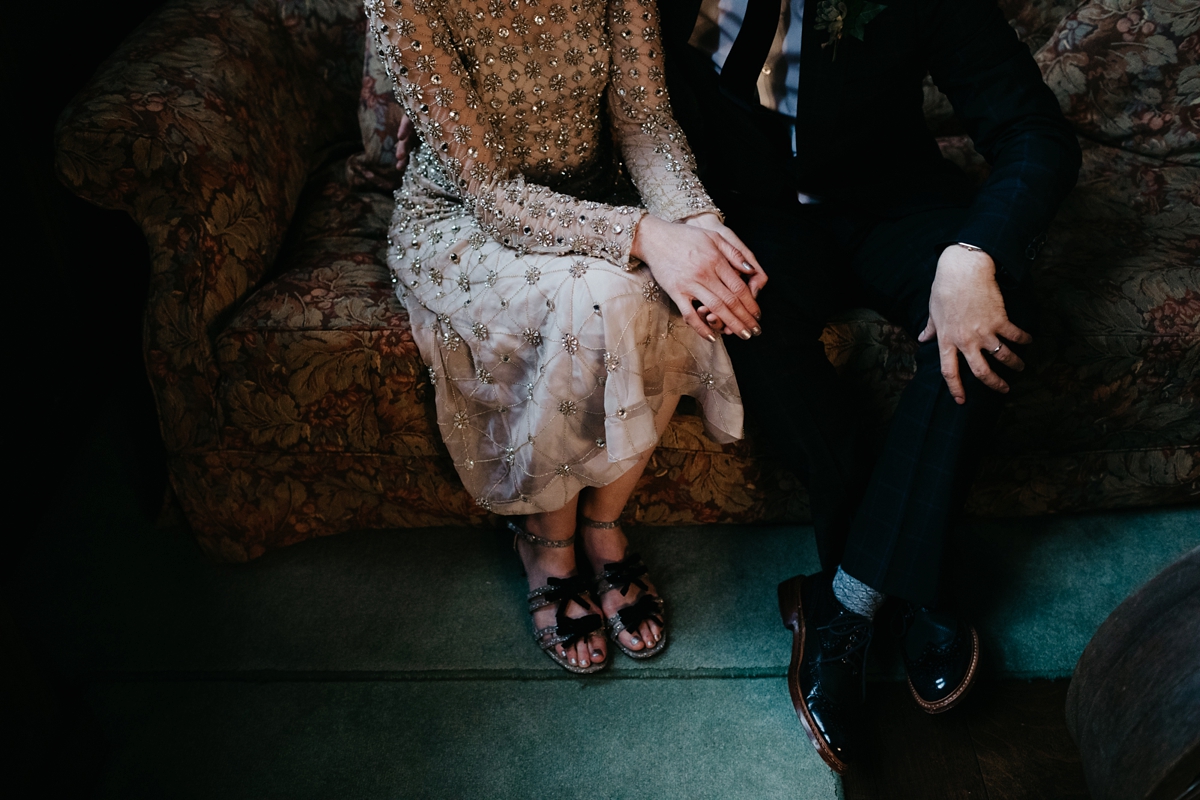 A bride in a gold, embellished Temperley London dress for her wedding at Rowallan Castle in Scotland. Images by Caro Weiss.