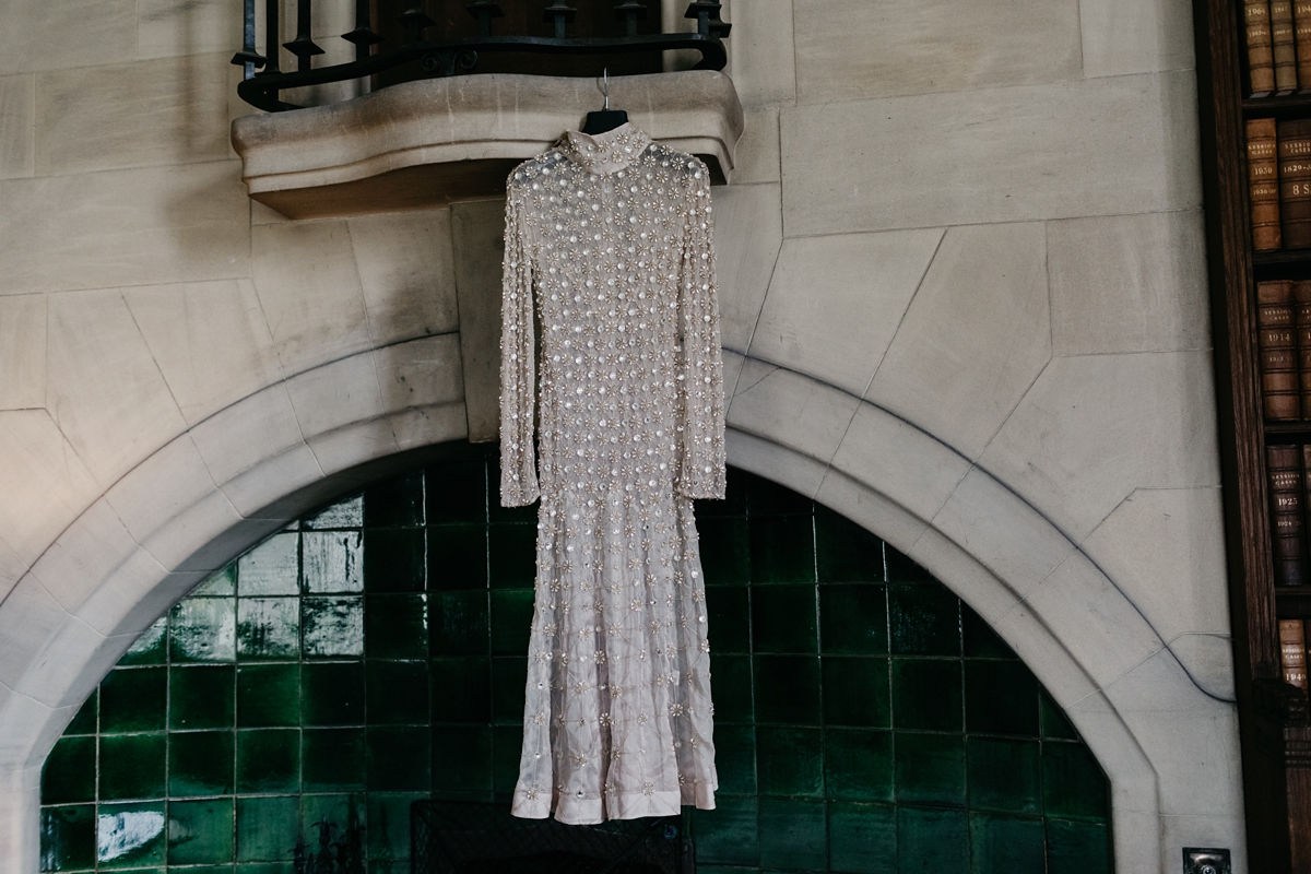 A bride in a gold, embellished Temperley London dress for her wedding at Rowallan Castle in Scotland. Images by Caro Weiss.