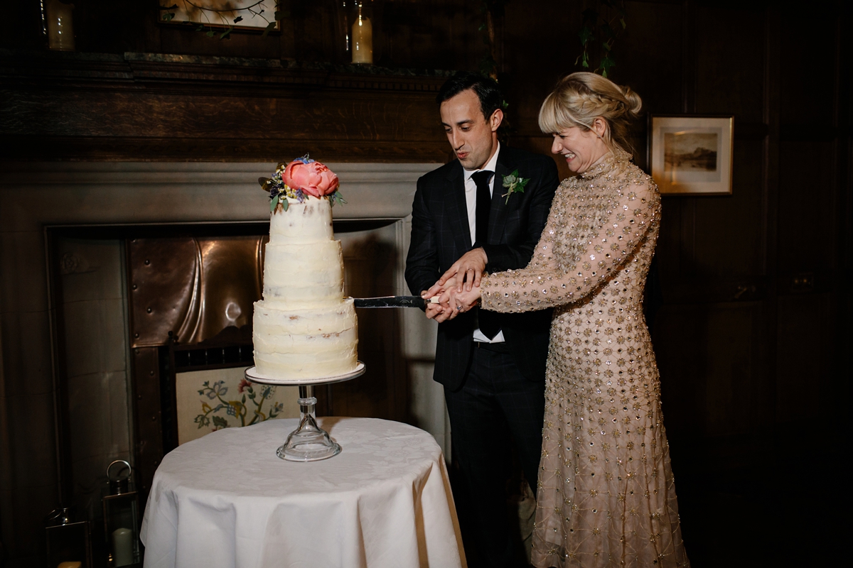 A bride in a gold, embellished Temperley London dress for her wedding at Rowallan Castle in Scotland. Images by Caro Weiss.