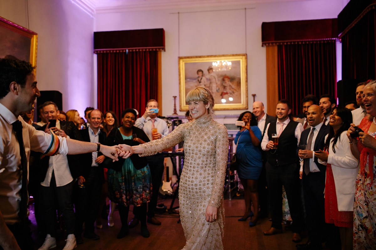 A bride in a gold, embellished Temperley London dress for her wedding at Rowallan Castle in Scotland. Images by Caro Weiss.