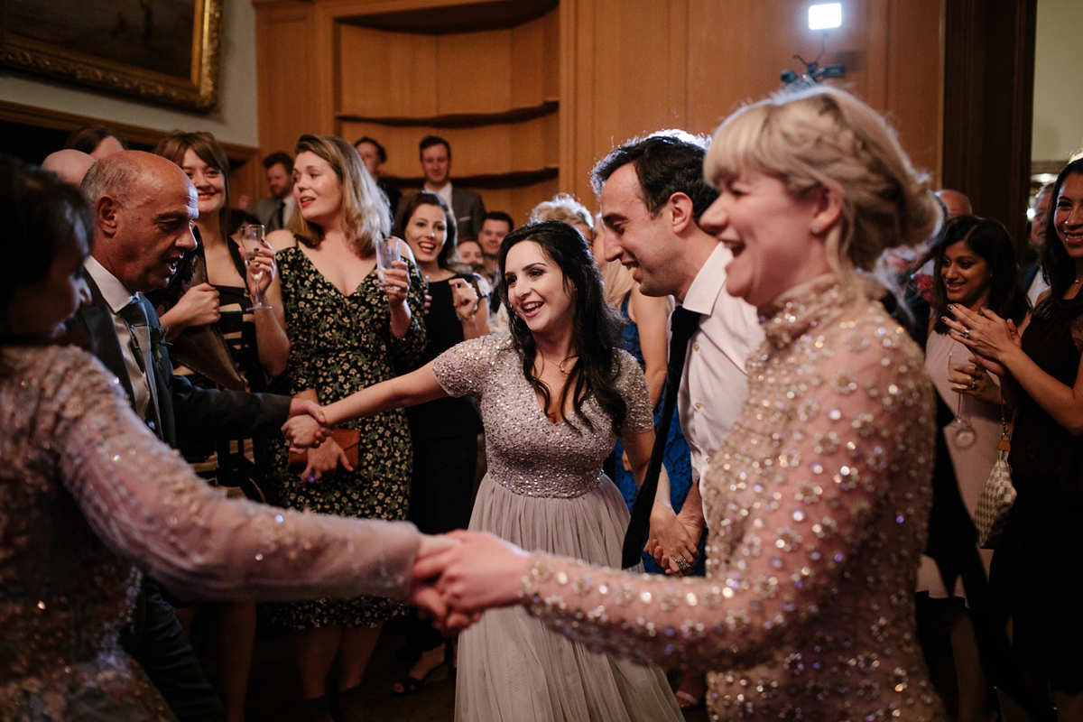 A bride in a gold, embellished Temperley London dress for her wedding at Rowallan Castle in Scotland. Images by Caro Weiss.