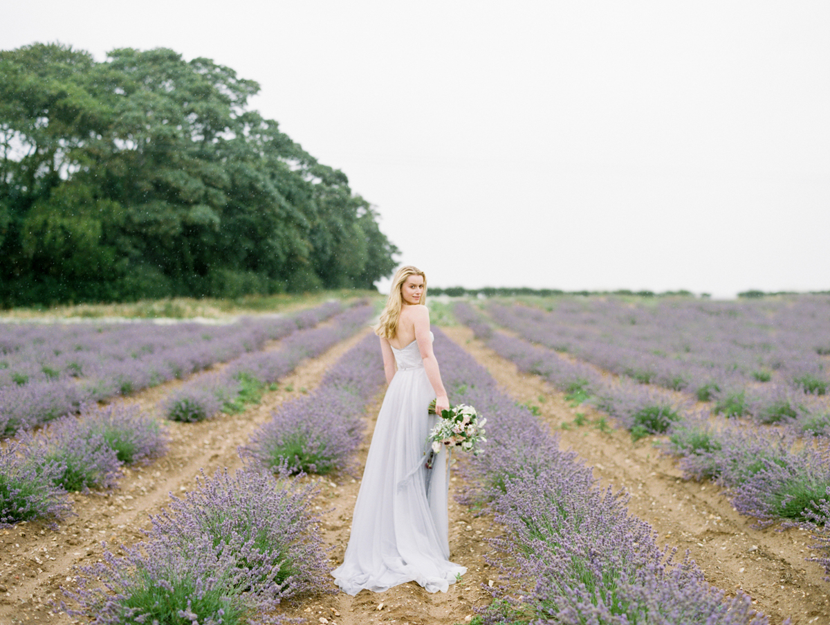 Elegant Naomi Neoh gown in a lavender field setting