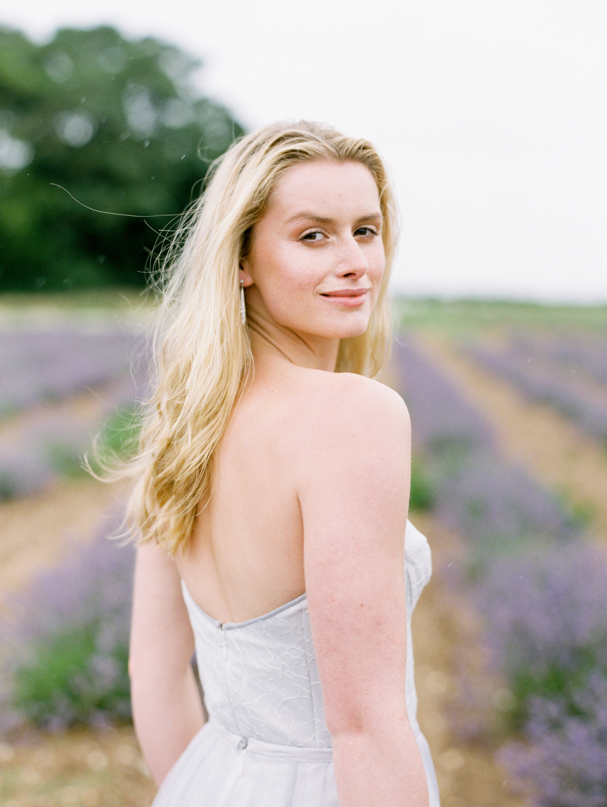 Elegant Naomi Neoh gown in a lavender field setting