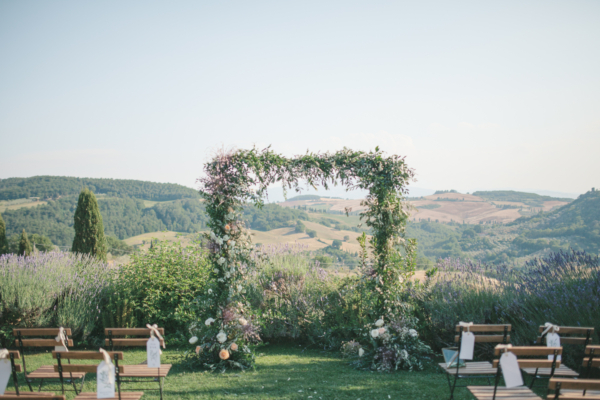 A Bespoke Lace Dress and Mismatched Maids for a Rustic Tuscan Vineyard Wedding