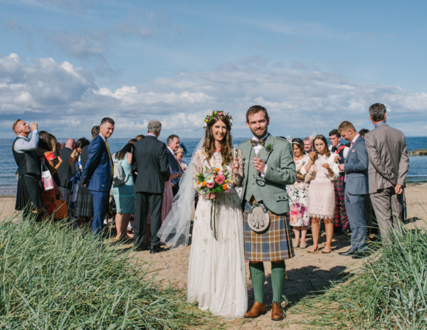 An Embroidered Needle & Thread gown for a Colourful Humanist Ceremony on the Beach