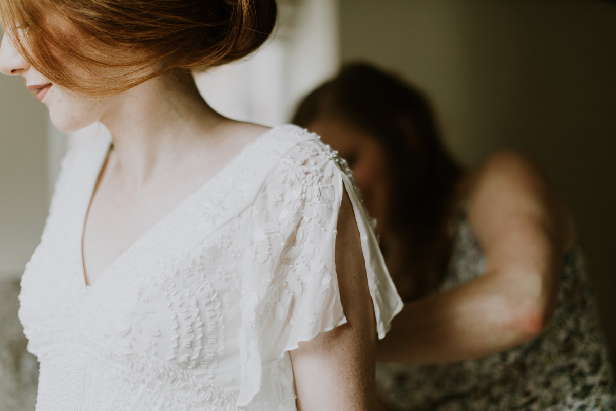 10 Bride being assisted into her Eliza Jane Howell wedding dress