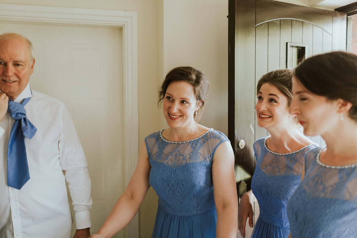 10 Bridesmaids in cornflower blue dresses from Monsoon