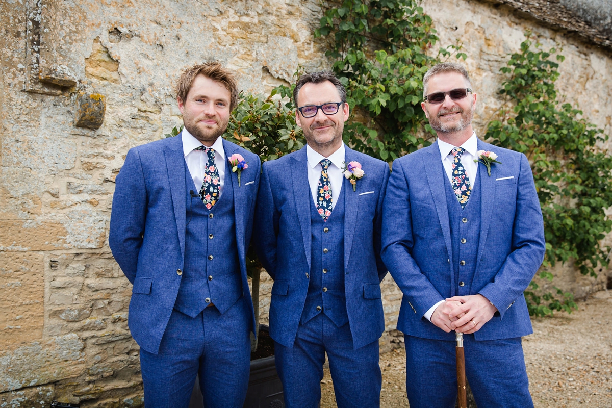 10 Groom wearing blue River Island suit and floral tie from Marc Wallace 1