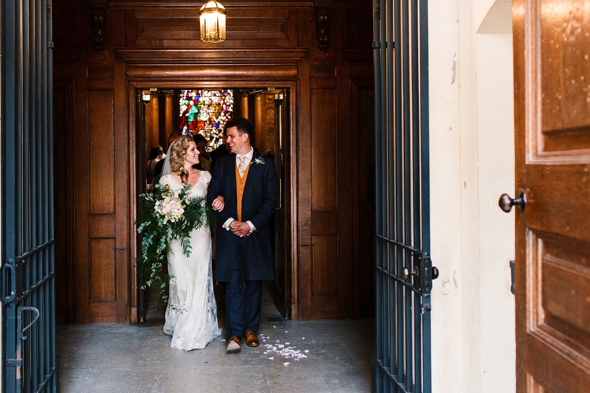 10 Just married bride carrying an oversized bouquet - A Sharon Hoey Dress and French Lace Veil for a Glamorous and Elegant City Wedding 10 Just married bride carrying an oversized bouquet