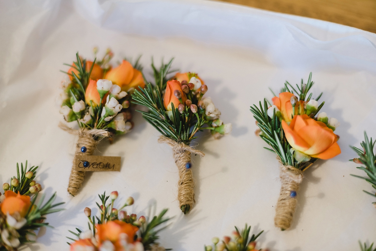11 Autumn wedding buttonholes with orange roses and