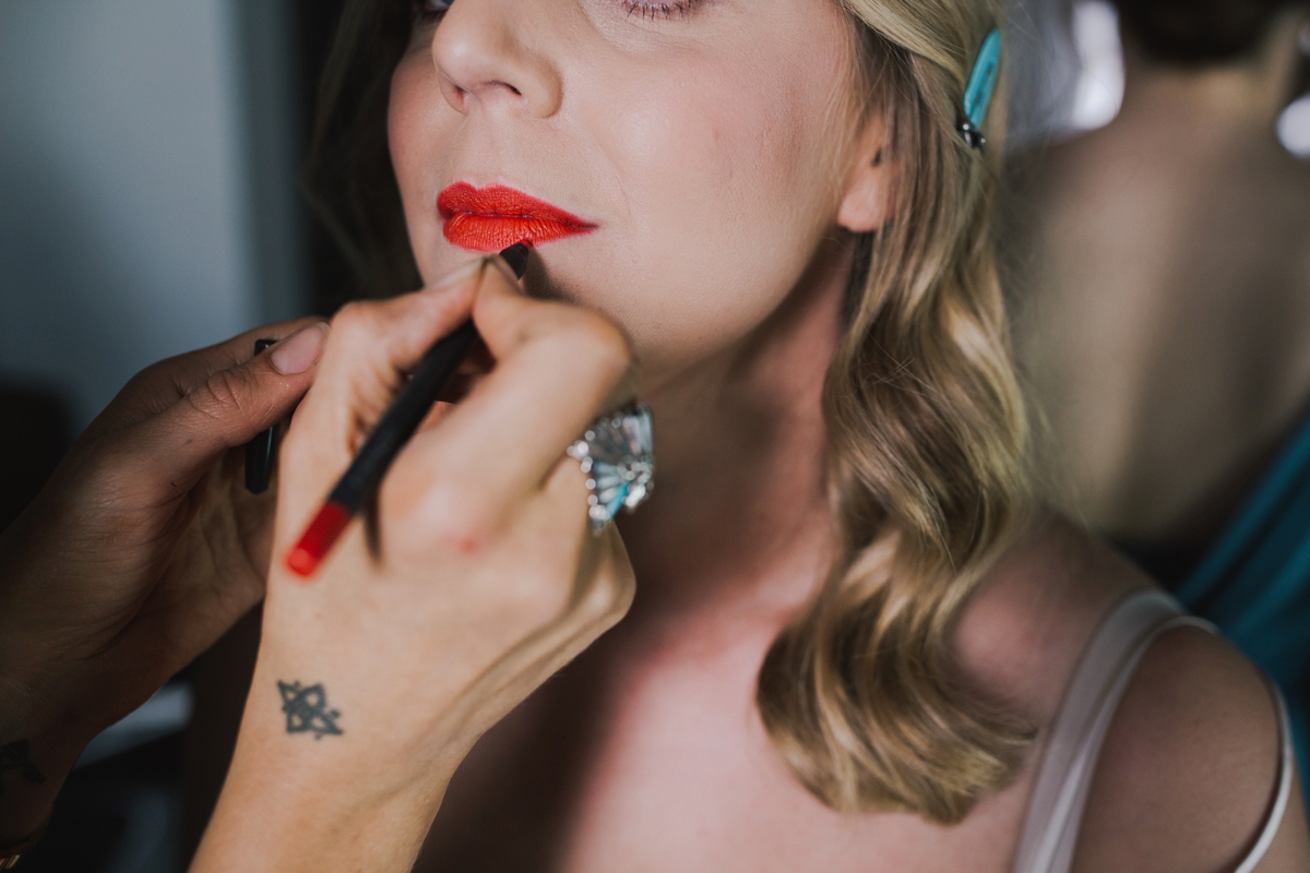 11 Bride wearing Lady Danger red lipstick