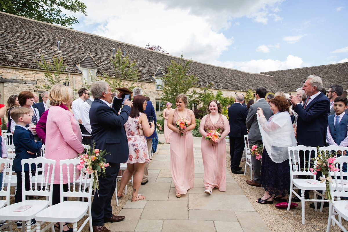 11 Bridesmaids in sandy pink halterneck dresses from Monsoon 1