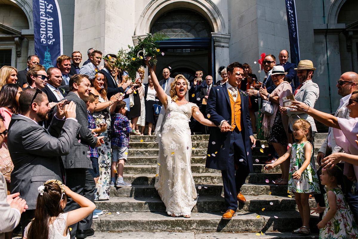11 Confetti shot with a joyous bride and groom - A Sharon Hoey Dress and French Lace Veil for a Glamorous and Elegant City Wedding 11 Confetti shot with a joyous bride and groom