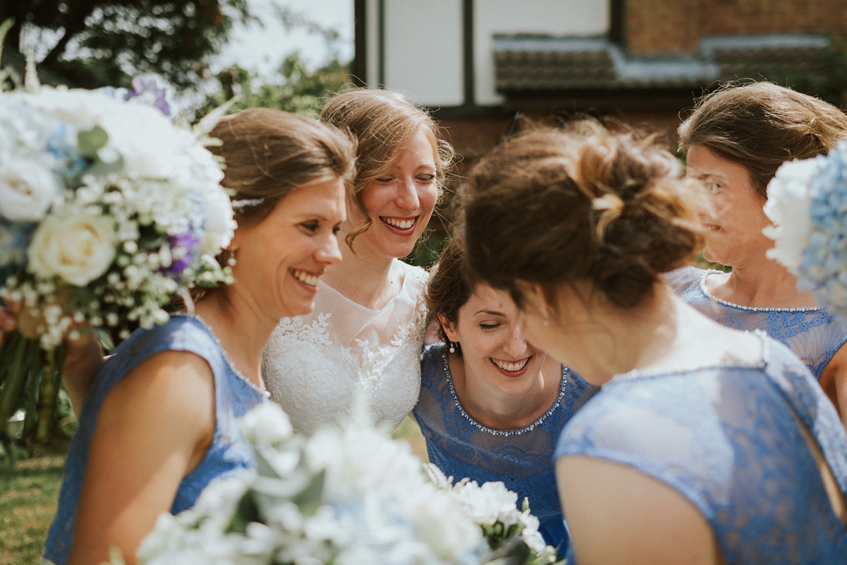 14 Bridesmaids in cornflower blue dresses from Monsoon