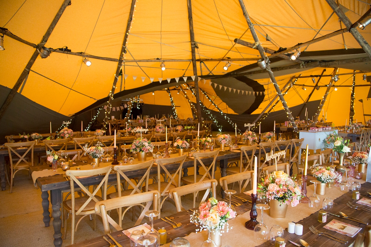16 Tressel tables inside a wedding tipi