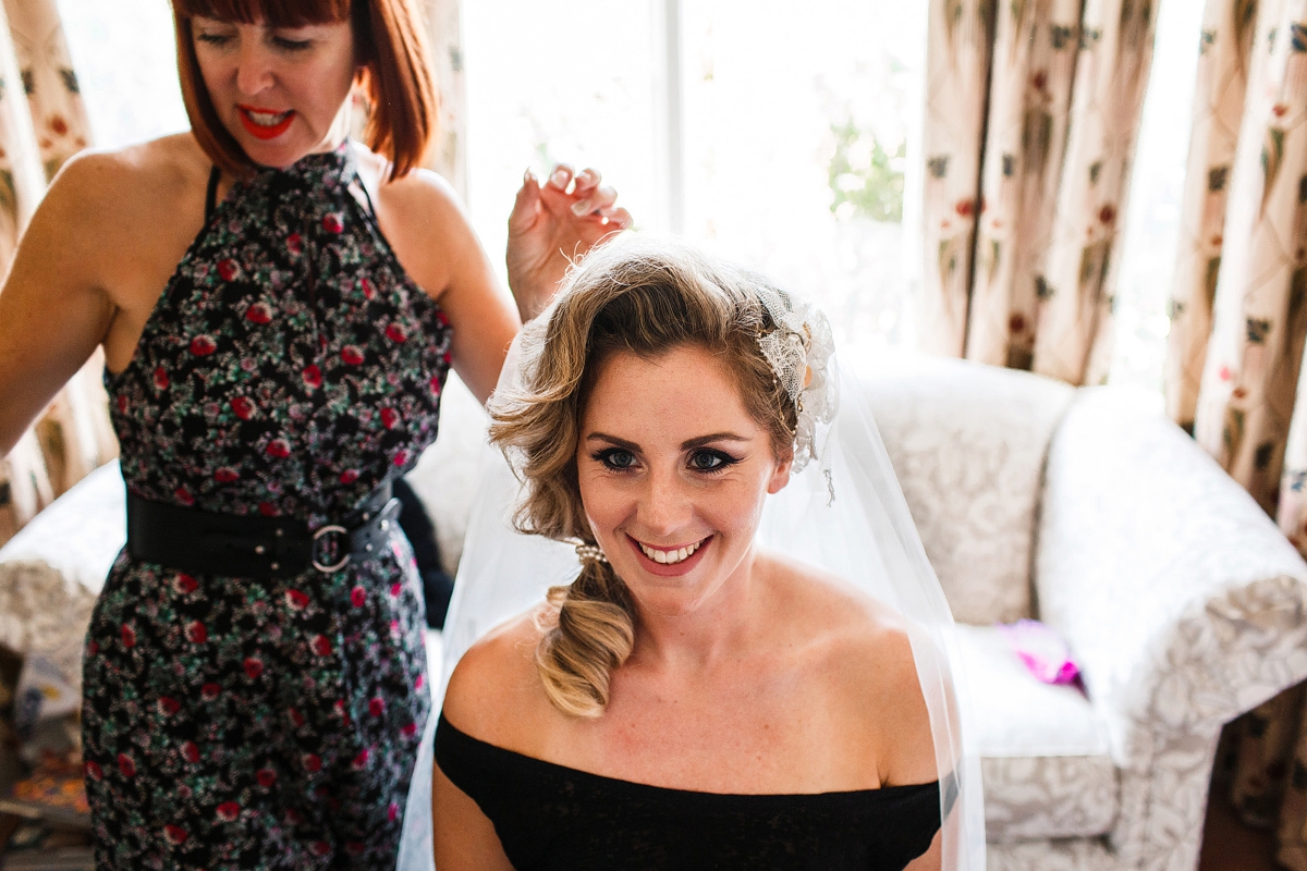 2 Bride getting her hair and makeup done - A Sharon Hoey Dress and French Lace Veil for a Glamorous and Elegant City Wedding 2 Bride getting her hair and makeup done
