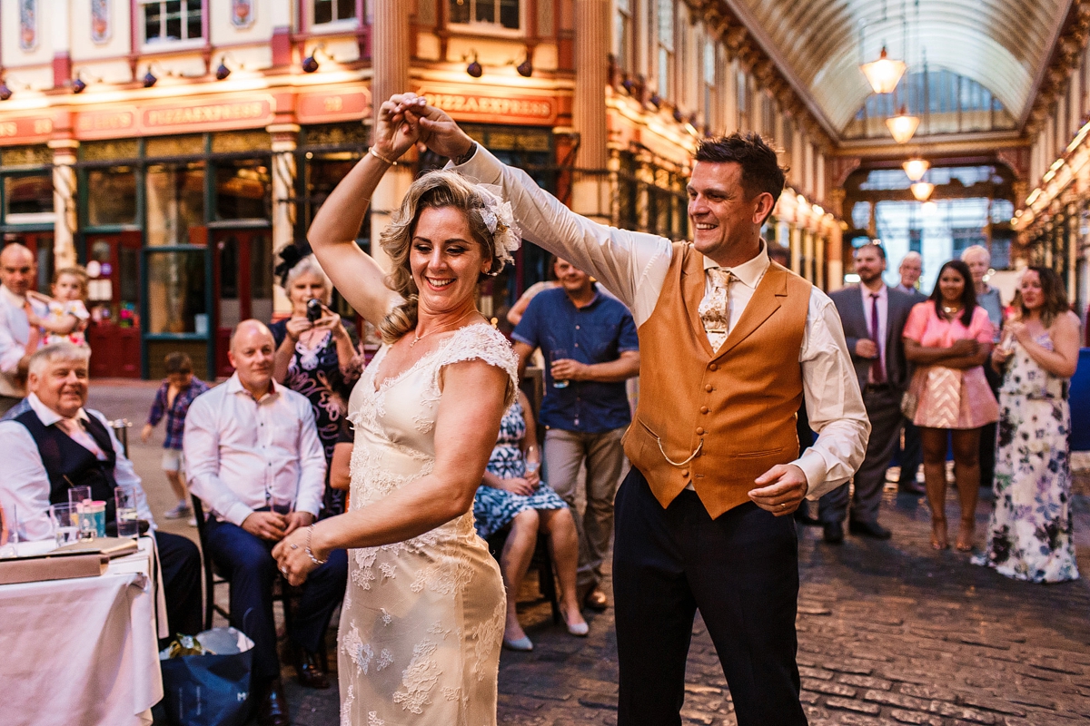23 Bride and grooms first dance - A Sharon Hoey Dress and French Lace Veil for a Glamorous and Elegant City Wedding 23 Bride and grooms first dance