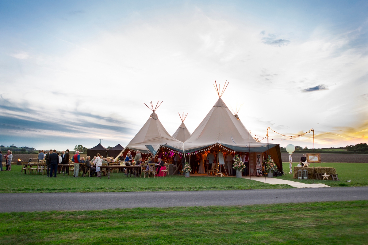 26 A Wtoo by Watters dress and colourful tipi wedding