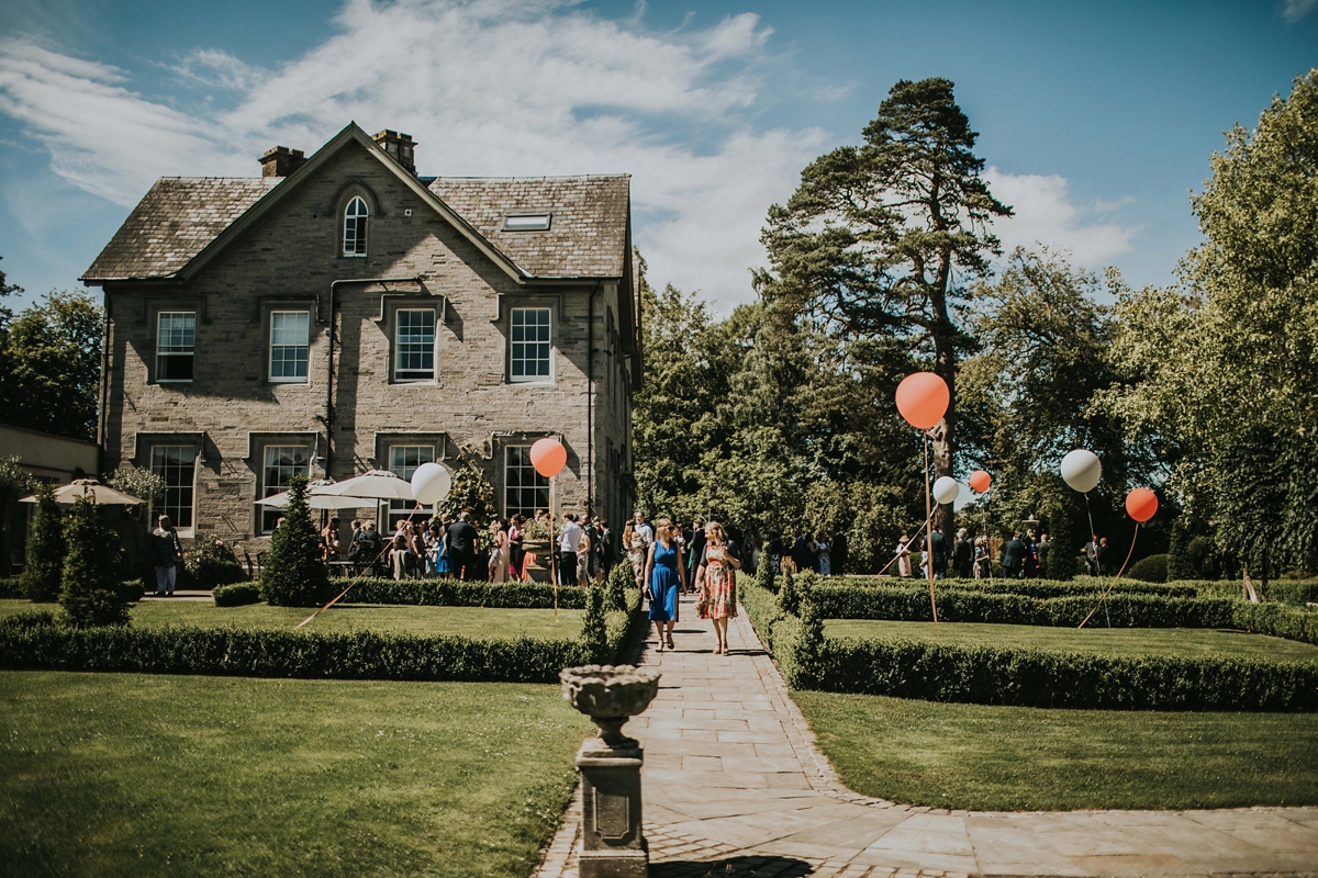 29 Colourful balloons outside Lemore Manor wedding venue