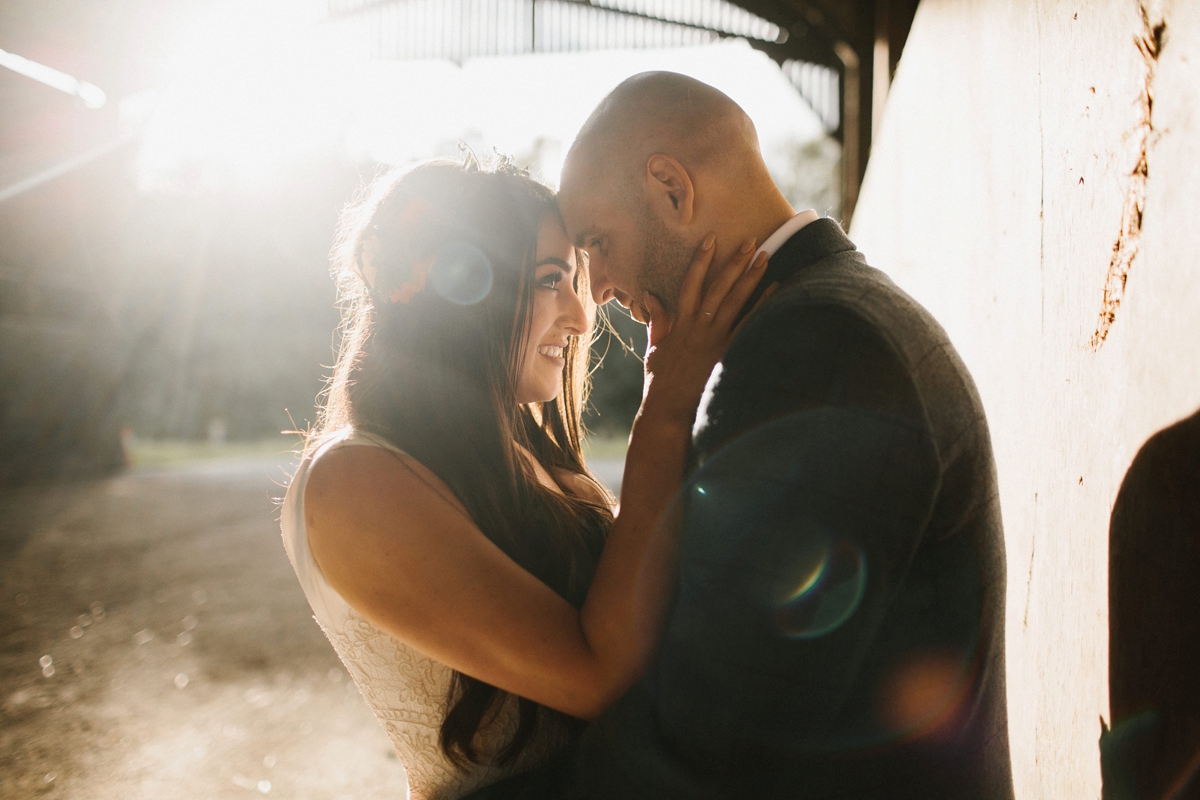 30 Bride and groom kissing during golden hour