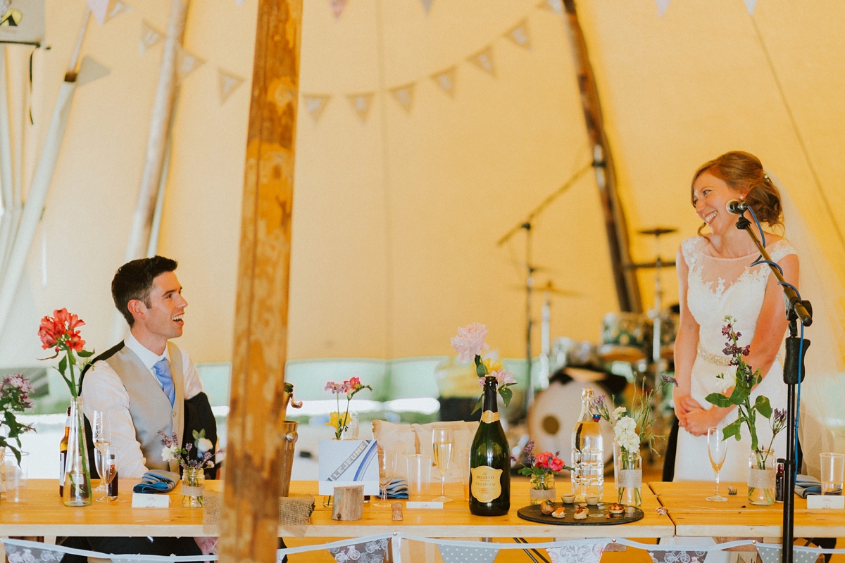 35 Bride giving a speech inside a wedding tipi