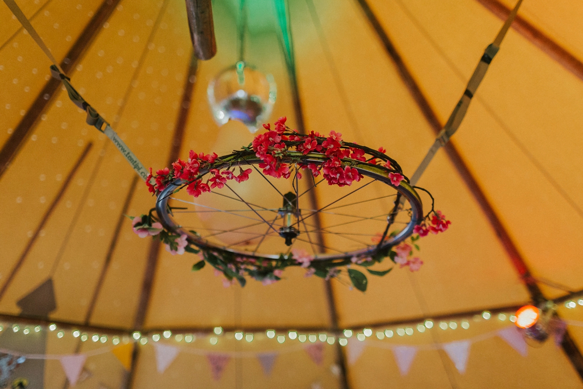 38 Floral chandelier inside a wedding tipi