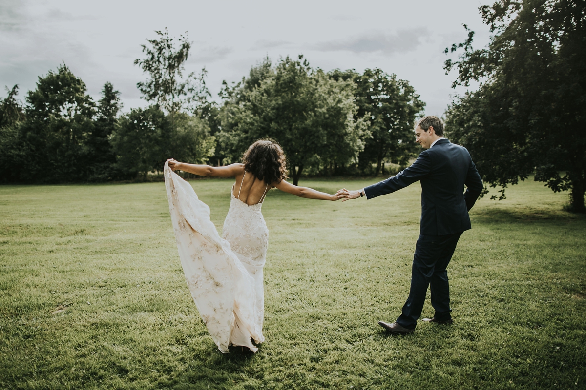 39 Bride and groom dancing on grass