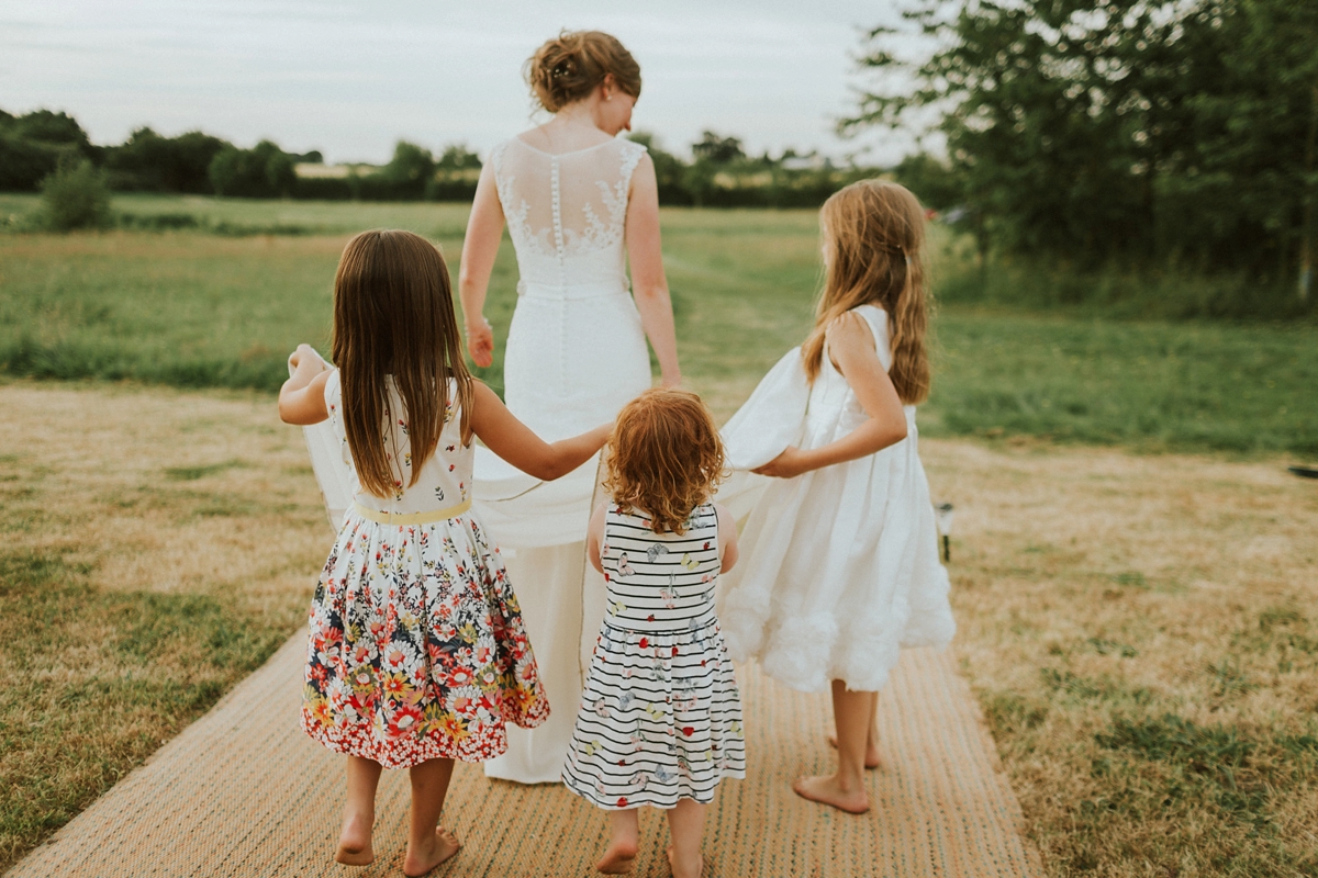 39 Bride playing with children at a wedding