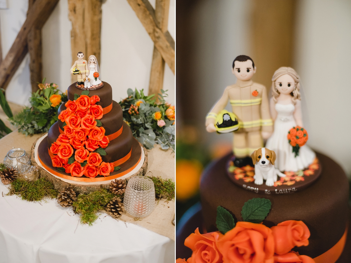 41 Chocolate wedding cake with fire fighter cake topper and orange iced flowers