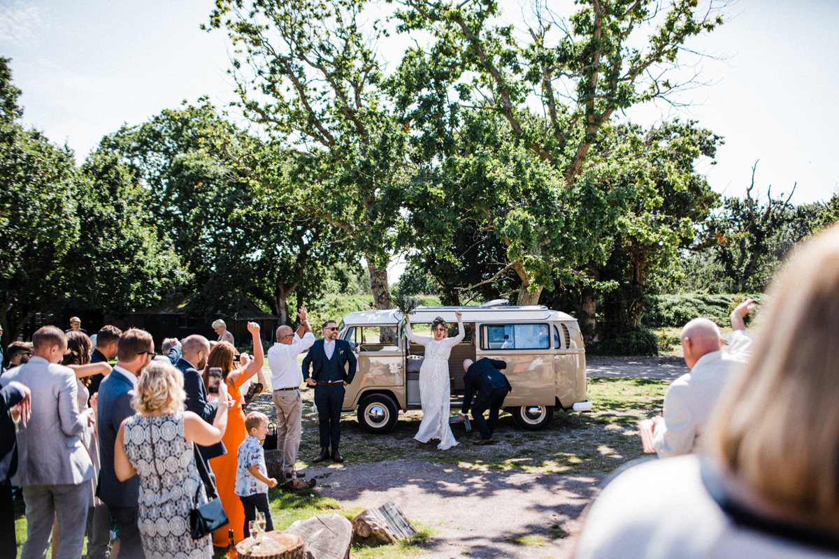 42 Newlywed Couple arriving in a beige VW camper van