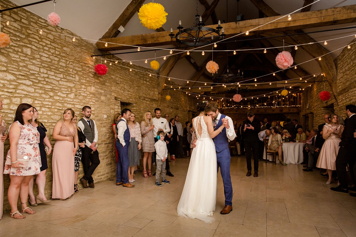 44 Barn wedding first dance and colourful hanging paper pompoms 1