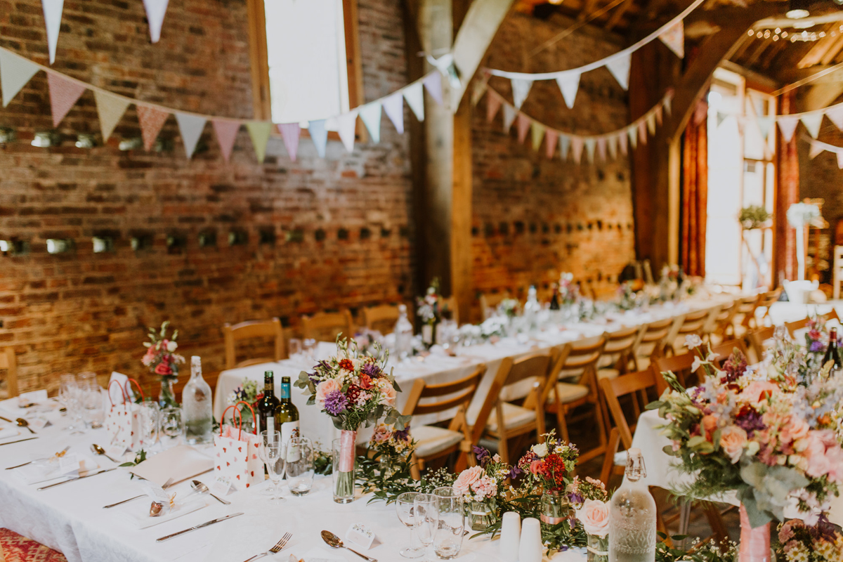 45 Poppleton Tithe Barn wedding venue tressel tables and bunting reception