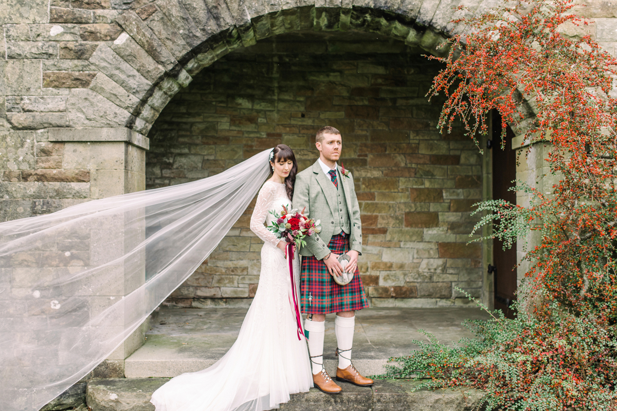 50 Groom wearing MacGregor and MacDuff and bride wearing Rosa Clara