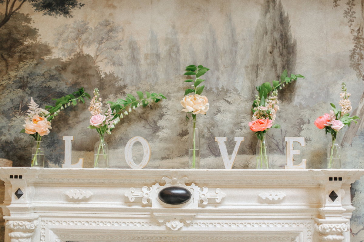 52 Single stem peach flowers in glass vases with LOVE letters