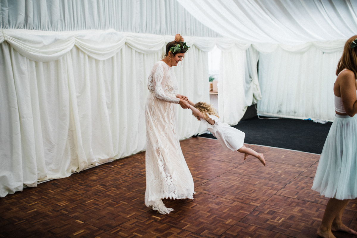 62 Bride swinging the flowergirl on the dance floor