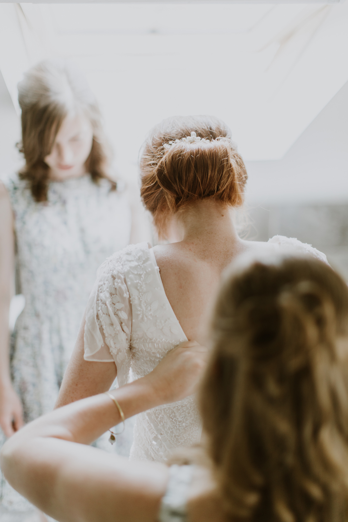 9 Bride being assisted into her Eliza Jane Howell wedding dress