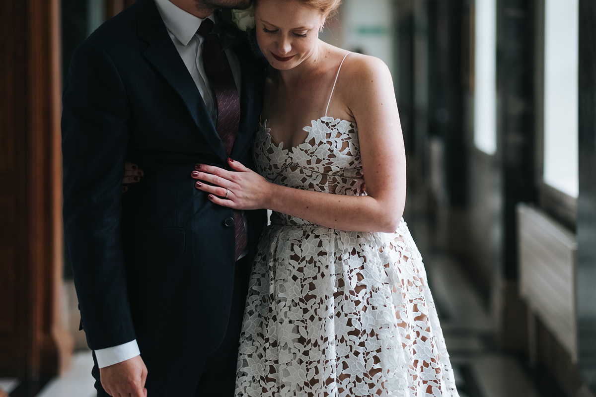 Bride embracing her groom at Islington Town Hall