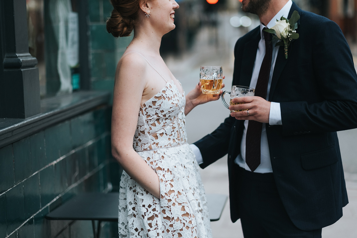 Bride enjoying a drink on her wedding day