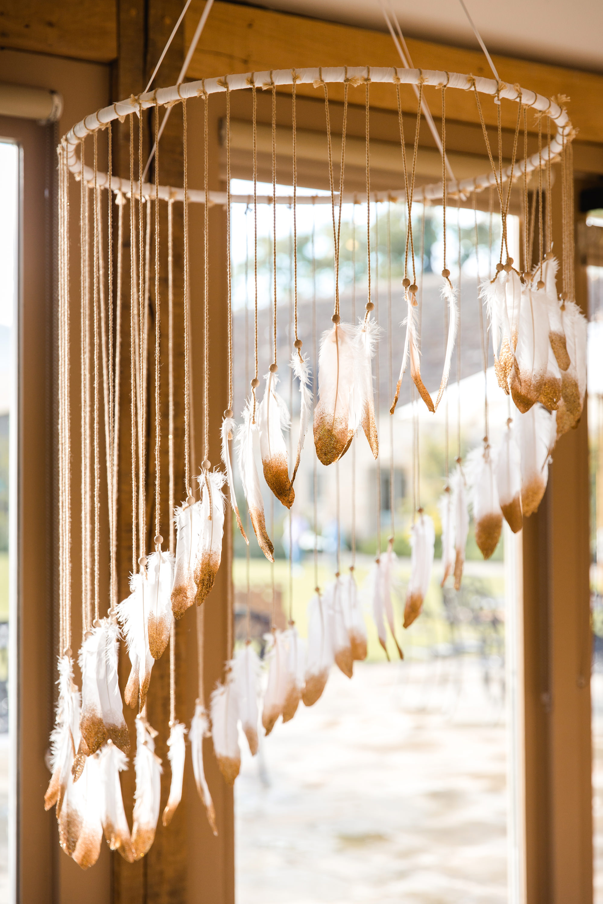 Giant feather chandelier bohemian wedding decor
