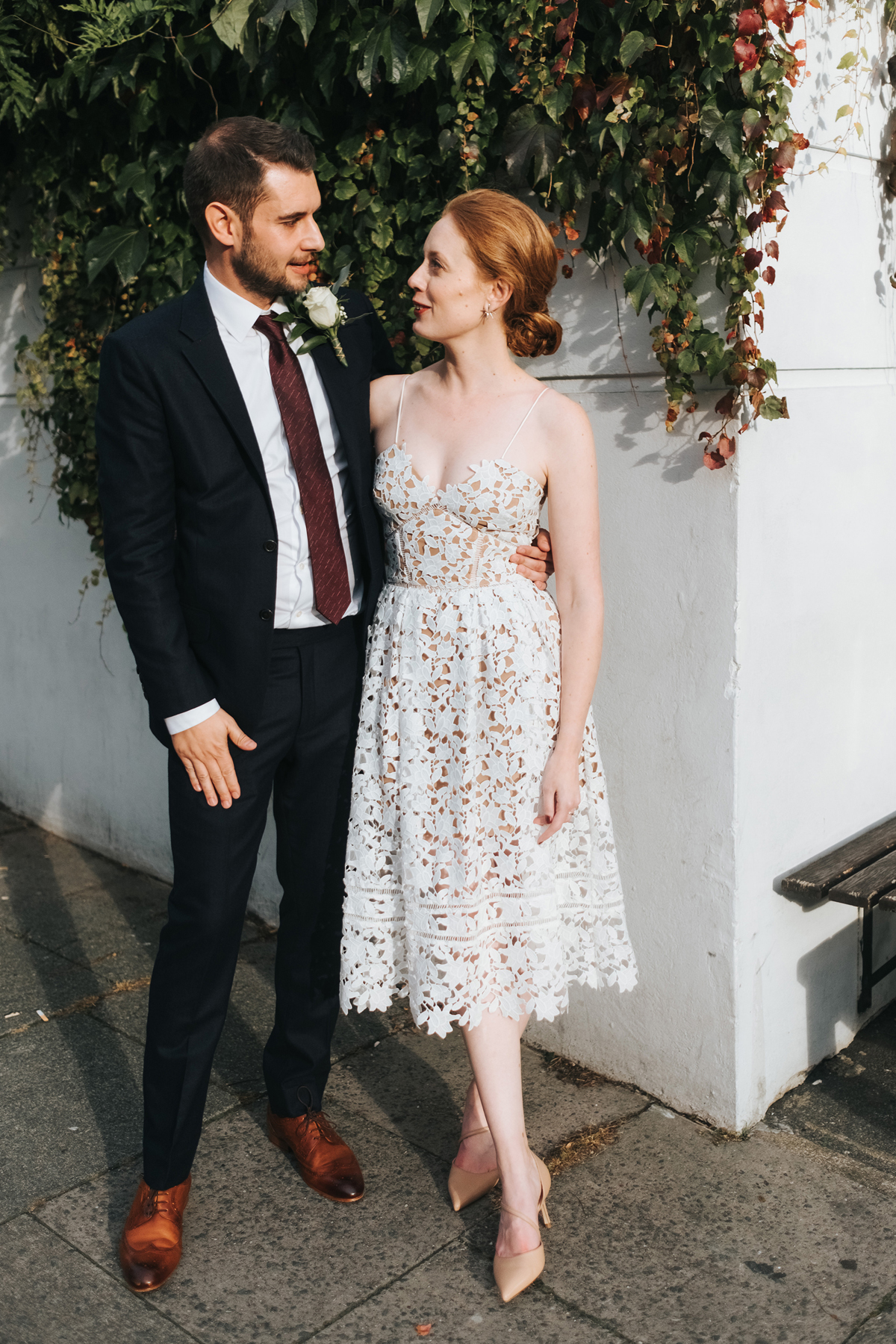 Groom wearing a Beggars Run suit and the bride wearing a Self Portrait dress