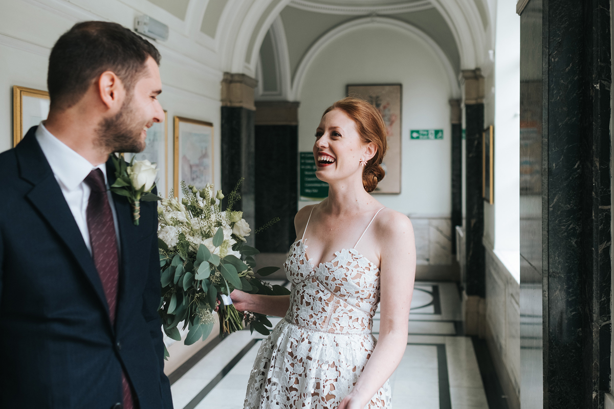 Happy newlywed couple at Islington Town Hall